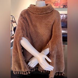 A faux fur women's brown poncho